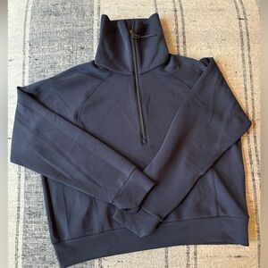 Spanx, softest sweatshirt EVER!! Grayish blue and hits at the belt line.